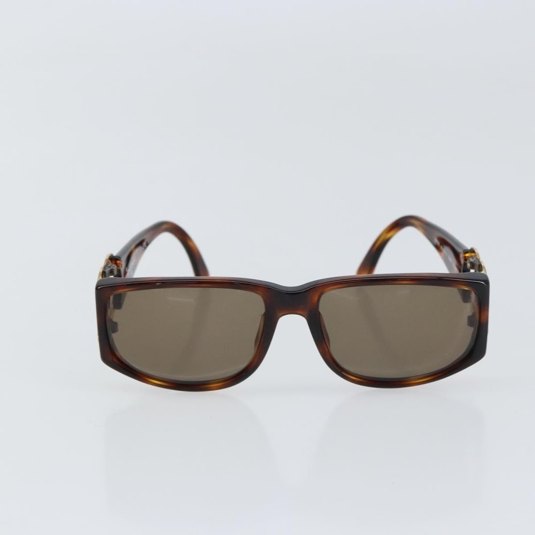 Brown Plastic Chanel CC Logo Women's Sunglasses: Brown Plastic Chanel CC Logo Women's Sunglasses These Chanel Logo CC sunglasses feature a brown plastic frame and are designed for women. Made in Italy, they display the iconic Chanel logo and come in
