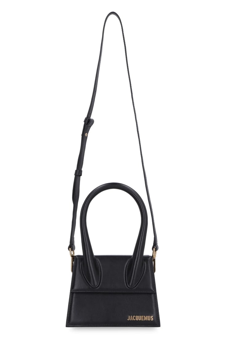 Jacquemus Le Chiquito Moyen Leather Handbag Black: Jacquemus Le Chiquito Moyen Leather Handbag Black This Jacquemus Le Chiquito Moyen bag is crafted from black leather and designed for women. It features a compact, structured silhouette perfect for st