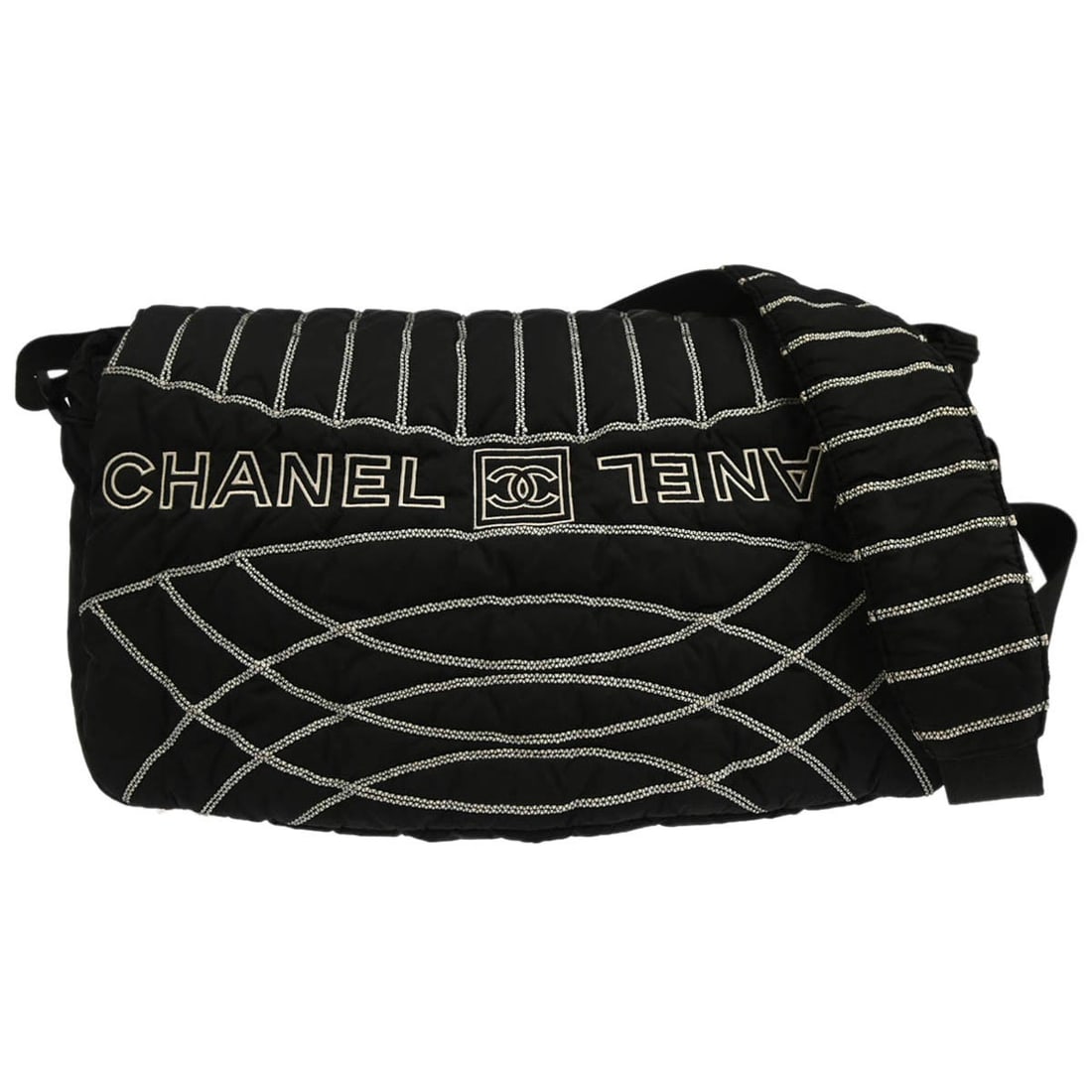 Black Nylon Medium Shoulder Bag Chanel Sport Line: Black Nylon Medium Shoulder Bag Chanel Sport Line This Chanel Sport Line shoulder bag is crafted from black nylon and features a medium-sized silhouette with a flap closure. Designed with a comfortabl