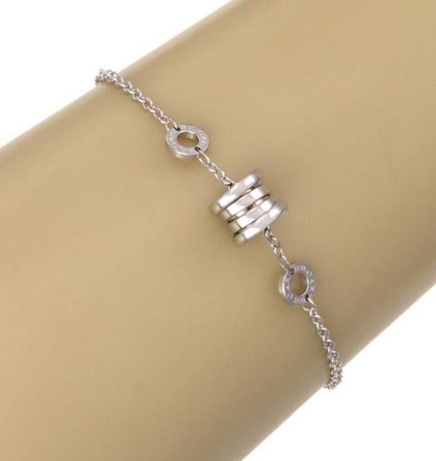 Bvlgari B Zero 1 Bracelet 18k White Gold Mini Charm Adjustable Chain: Bvlgari B Zero 1 Bracelet 18k White Gold Mini Charm Adjustable Chain Discover the elegance of this authentic Bvlgari B Zero 1 Bracelet, meticulously crafted from 18k white gold with a lustrous polishe