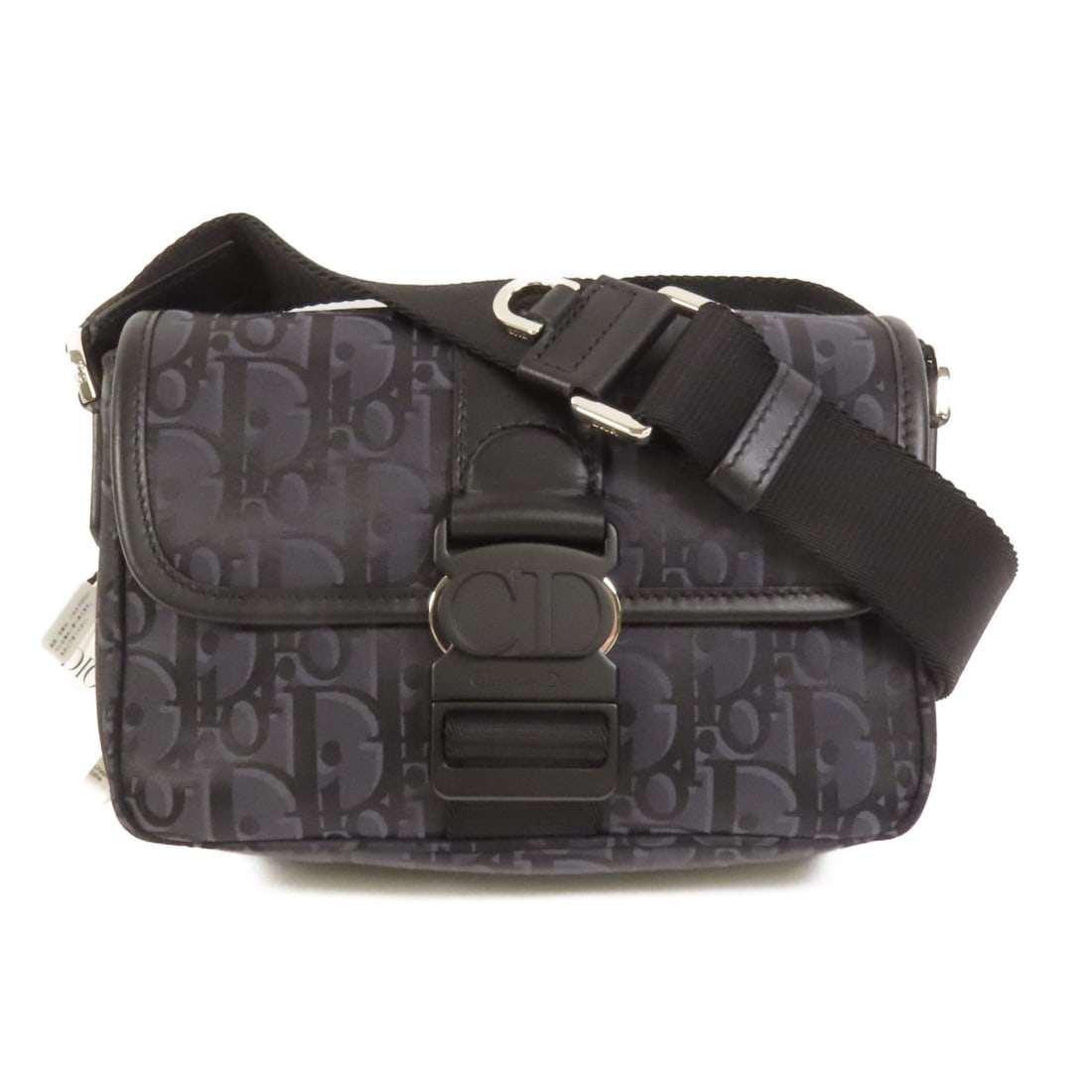 Dior Trek Black Nylon Shoulder Bag Silver Hardware: Dior Trek Black Nylon Shoulder Bag Silver Hardware This Dior Trek shoulder bag features a sleek design crafted from black nylon. Made in France, it offers a compact silhouette with a regular size type