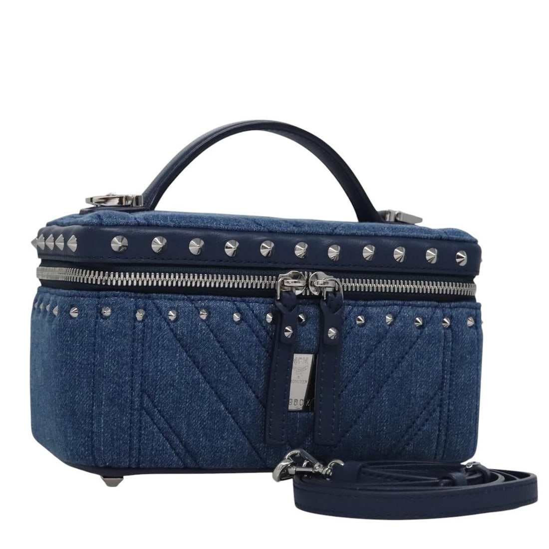 MCM Blue Denim Vanity Pouch Canvas 2way with Dust Bag: MCM Blue Denim Vanity Pouch Canvas 2way with Dust Bag This MCM Vanity Pouch offers a stylish and practical accessory for everyday use. Crafted in Korea from durable canvas, this pouch features a vibra