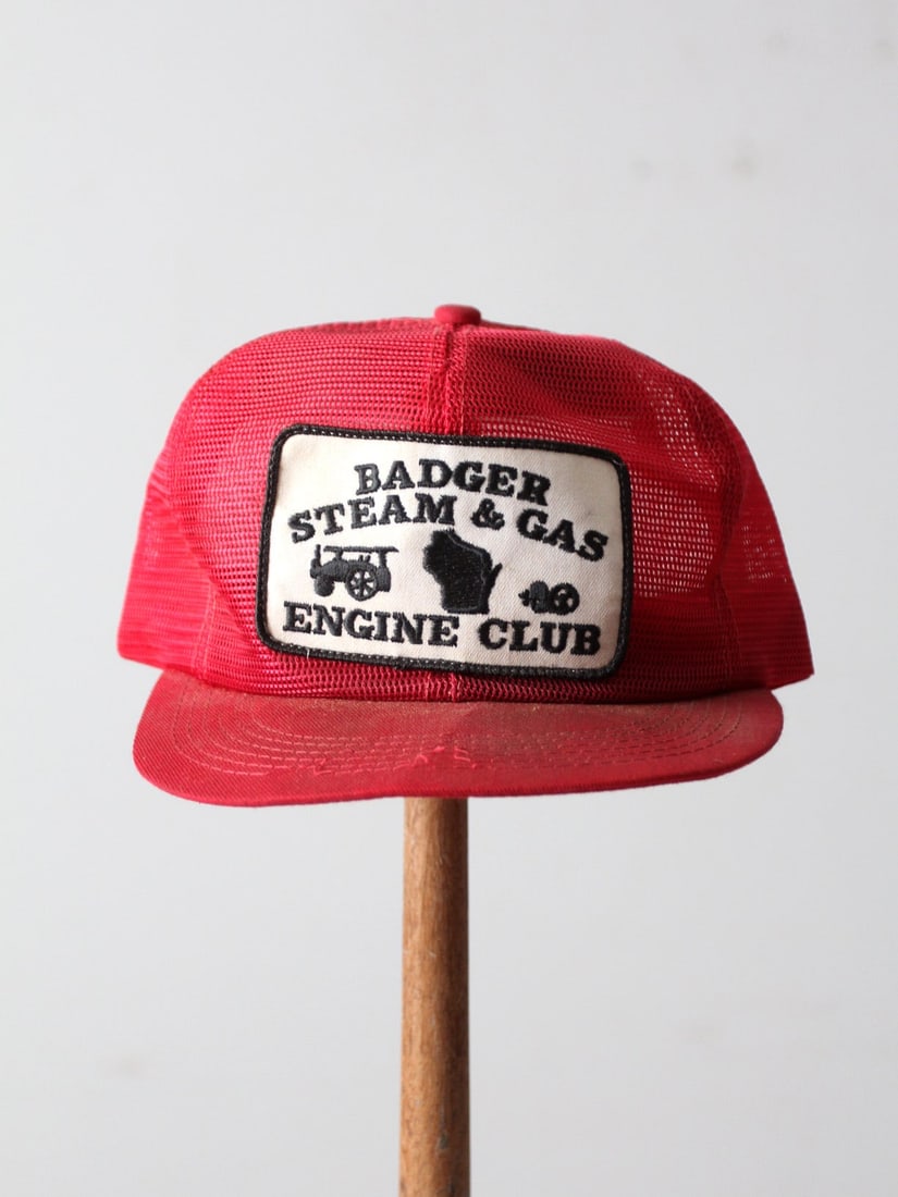 Vintage Badger Steam & Gas Engine Club Red Trucker Hat: Vintage Badger Steam & Gas Engine Club Red Trucker Hat Embrace a classic look with this Vintage Red Trucker Hat from the Badger Steam and Gas Engine Club. This stylish retro hat features a vibrant red