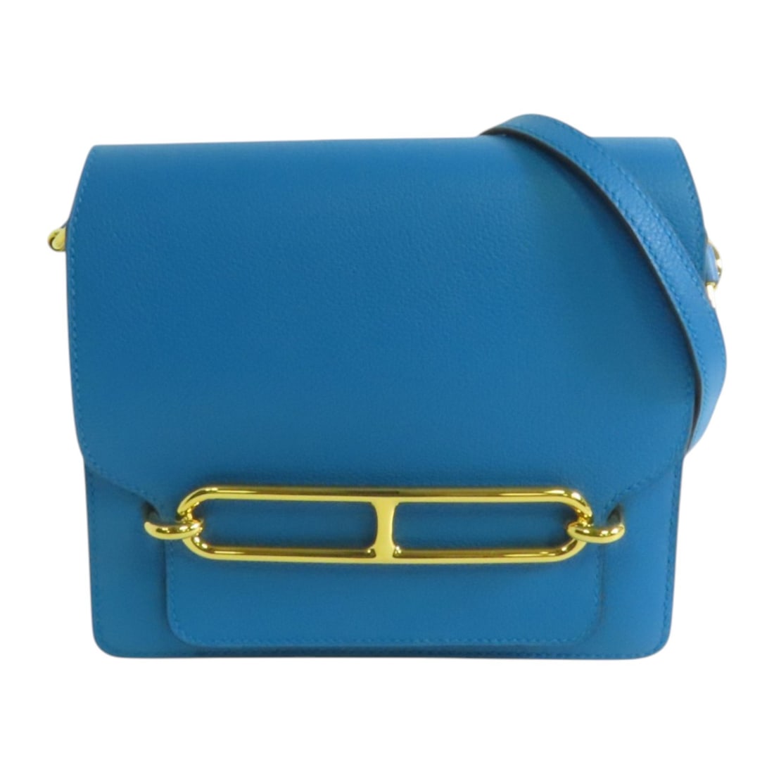 HERMES Roulis Mini Shoulder Bag Evercolour Leather Blue Zanzibar: HERMES Roulis Mini Shoulder Bag Evercolour Leather Blue Zanzibar This exquisite HERMES Roulis Mini Shoulder Bag is crafted from high-quality Evercolour leather, featuring a stunning Blue Zanzibar hue.