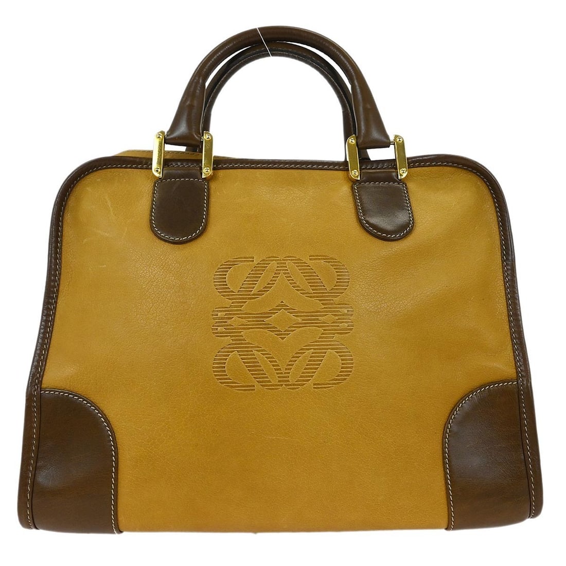 Loewe Beige Leather Top Handle Handbag from Spain: Loewe Beige Leather Top Handle Handbag from Spain This elegant Loewe handbag combines sophistication with practicality, featuring a beautiful beige leather exterior that exudes luxury. The medium-size