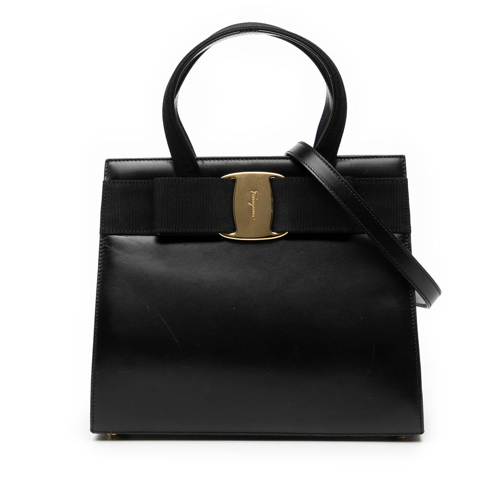 Black Leather Satchel with Vara Bow and Shoulder Strap by Ferragamo: Black Leather Satchel with Vara Bow and Shoulder Strap by Ferragamo This Ferragamo Vara Bow Satchel is crafted from black leather and features flat top handles, a detachable flat shoulder strap, top m