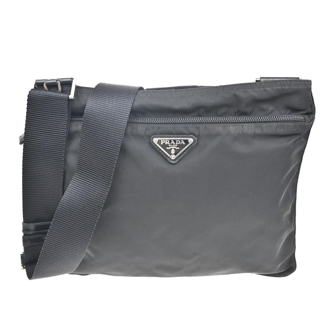 Prada Black Nylon Unisex Messenger Bag with Front Pocket: Prada Black Nylon Unisex Messenger Bag with Front Pocket This Prada Front Pocket Messenger Bag is crafted from durable black nylon and designed for unisex use. It features a front pocket for added con