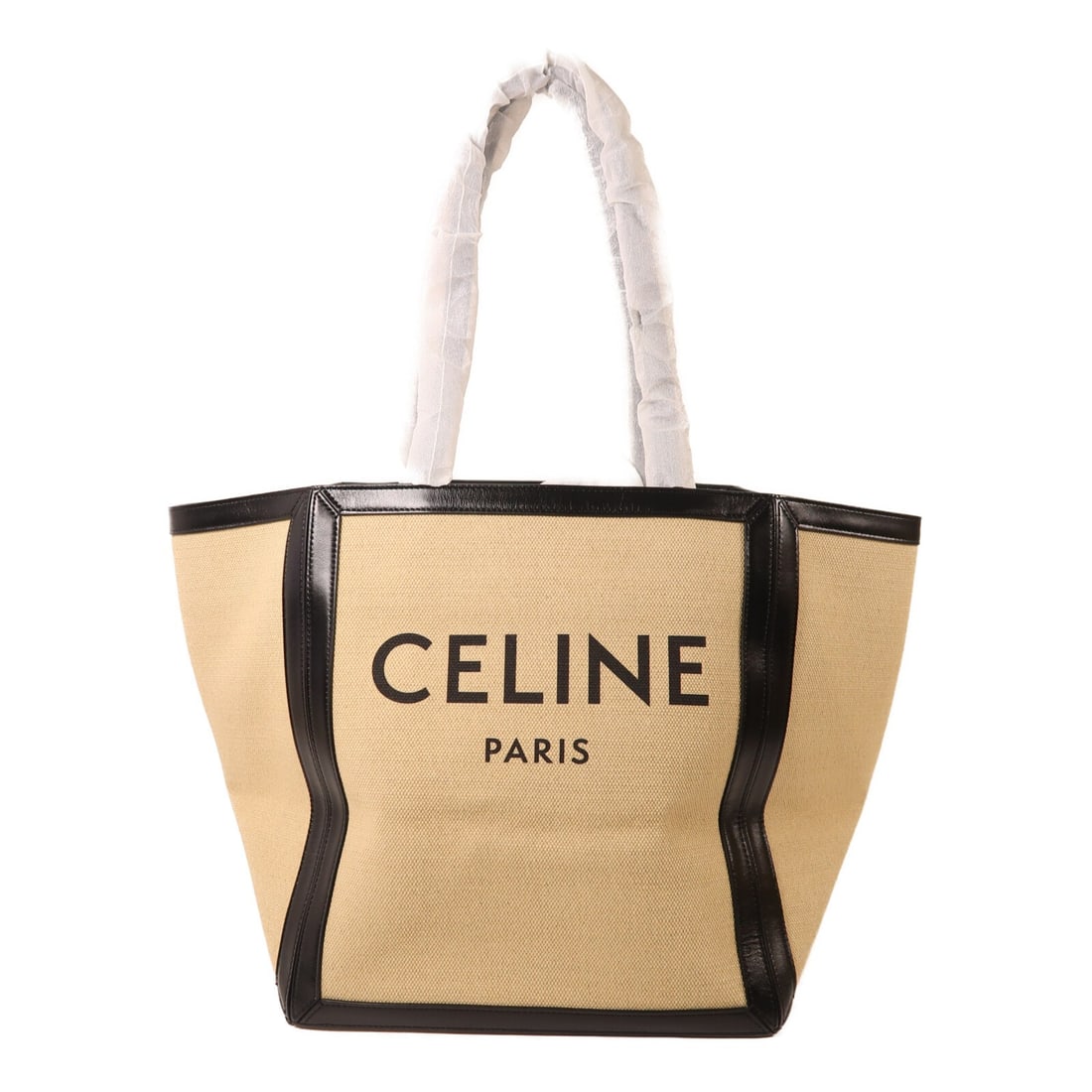 Celine Beige and Black Canvas Leather Tote with Gold Tone Hardware: Celine Beige and Black Canvas Leather Tote with Gold Tone Hardware This CELINE tote bag features a stylish design crafted from beige canvas with leather accents. The bag offers a spacious interior, ma