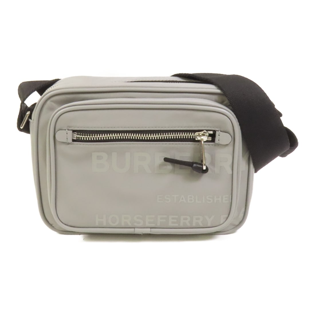 Nylon Gray BURBERRY Shoulder Bag with Silver Tone Hardware: Nylon Gray BURBERRY Shoulder Bag with Silver Tone Hardware This Burberry shoulder bag features a sleek gray nylon exterior and a regular size, offering a lightweight and stylish accessory for everyday