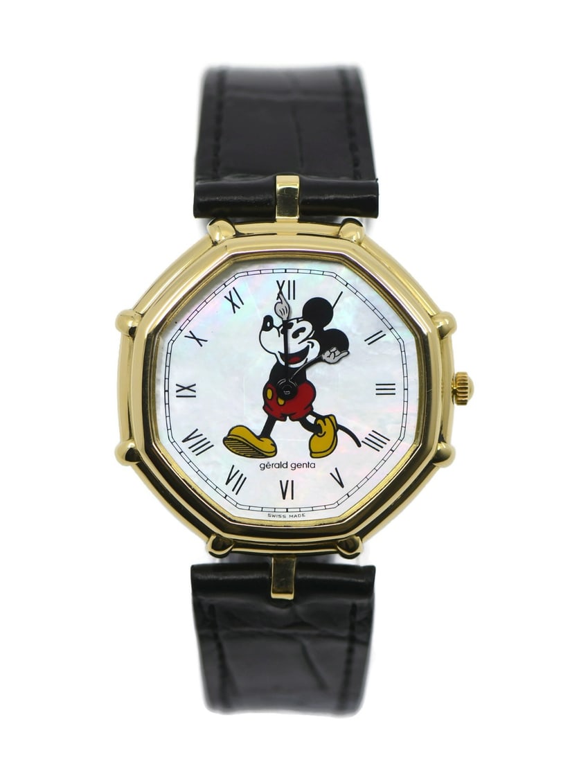 Gerald Genta 18K Gold Quartz Mickey Mouse Wristwatch Ref G3260.7 35mm: Gerald Genta 18K Gold Quartz Mickey Mouse Wristwatch Ref G3260.7 35mm This Gerald Genta Mickey Mouse wristwatch features a 35 mm case crafted from 18K yellow gold and a mother of pearl dial. Powered b