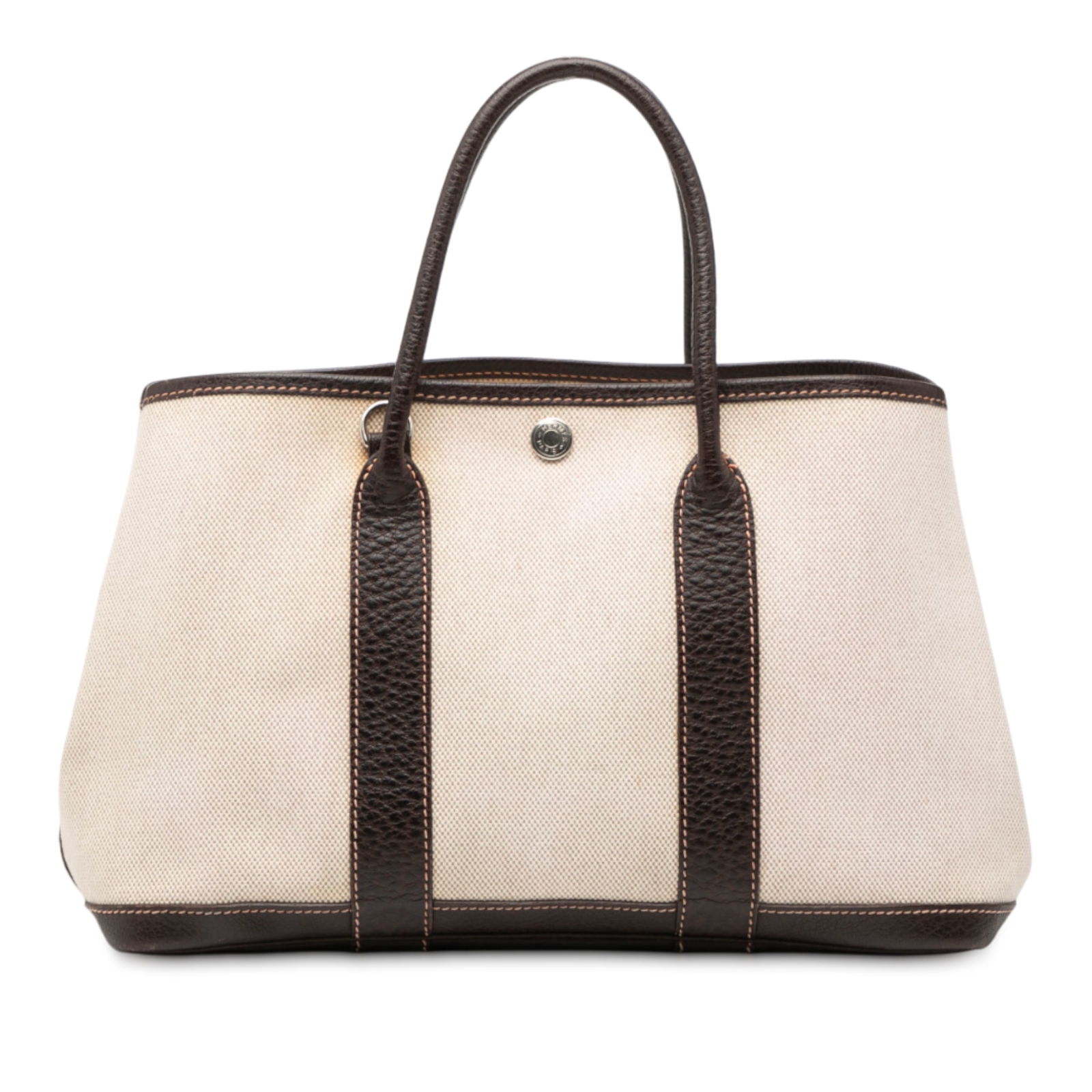 Toile and Negonda Garden Party 30 canvas and leather tote by Hermes: Toile and Negonda Garden Party 30 canvas and leather tote by Hermes The Hermes Toile and Negonda Garden Party 30 is a sophisticated handbag featuring a canvas body with textured leather trim and rolle