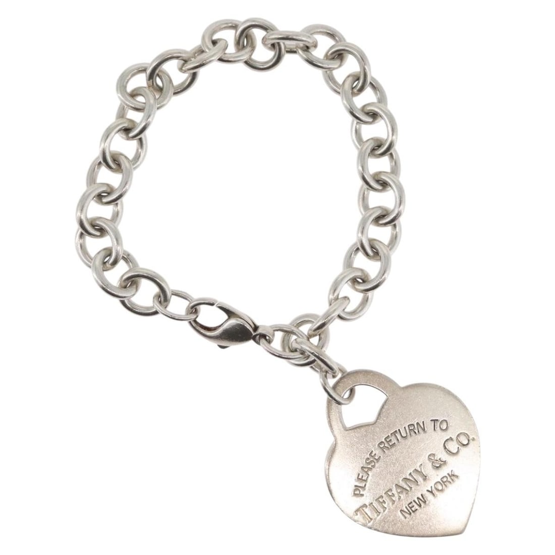 Silver Heart Tag Bracelet by Tiffany and Co with Dust Bag and Box: Silver Heart Tag Bracelet by Tiffany and Co with Dust Bag and Box This authentic Tiffany & Co. Return To Heart bracelet is crafted from Ag925 silver and features a heart-shaped tag. The bracelet is ma