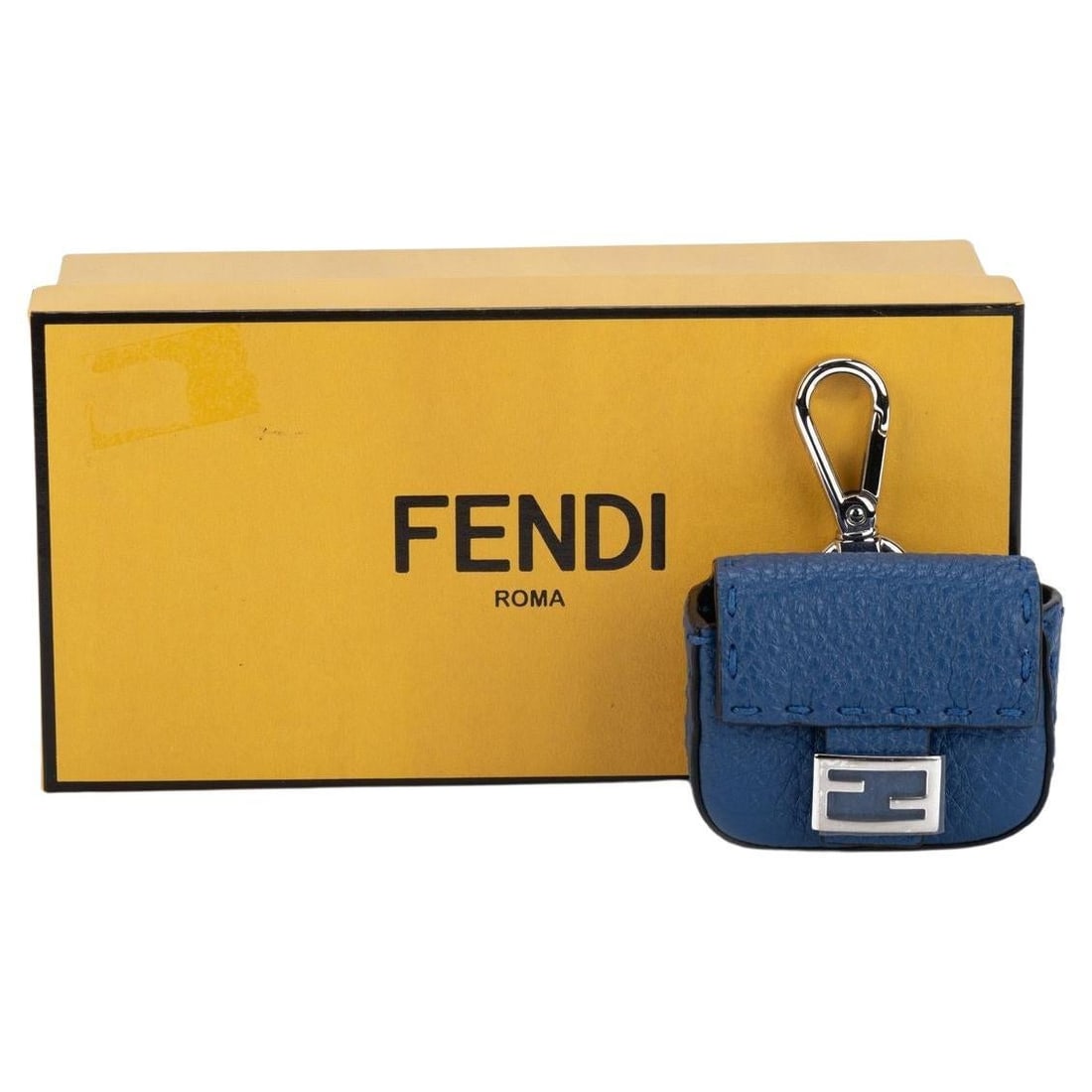 Fendi Micro Baguette AirPods Case Leather Blue Italy: Fendi Micro Baguette AirPods Case Leather Blue Italy Introducing the Fendi Micro Baguette Air Pods Case in a striking blue hue. This exquisite accessory is not only a stylish way to carry your AirPods