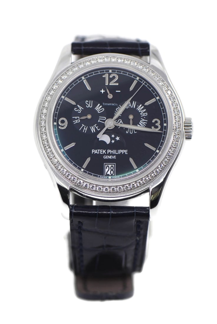 Patek Philippe 5147G Tiffany Automatic 18K White Gold Watch with Box: Patek Philippe 5147G Tiffany Automatic 18K White Gold Watch with Box Introducing the exquisite Patek Philippe Annual Calendar Tiffany wristwatch, a stunning blend of luxury and precision. This excepti