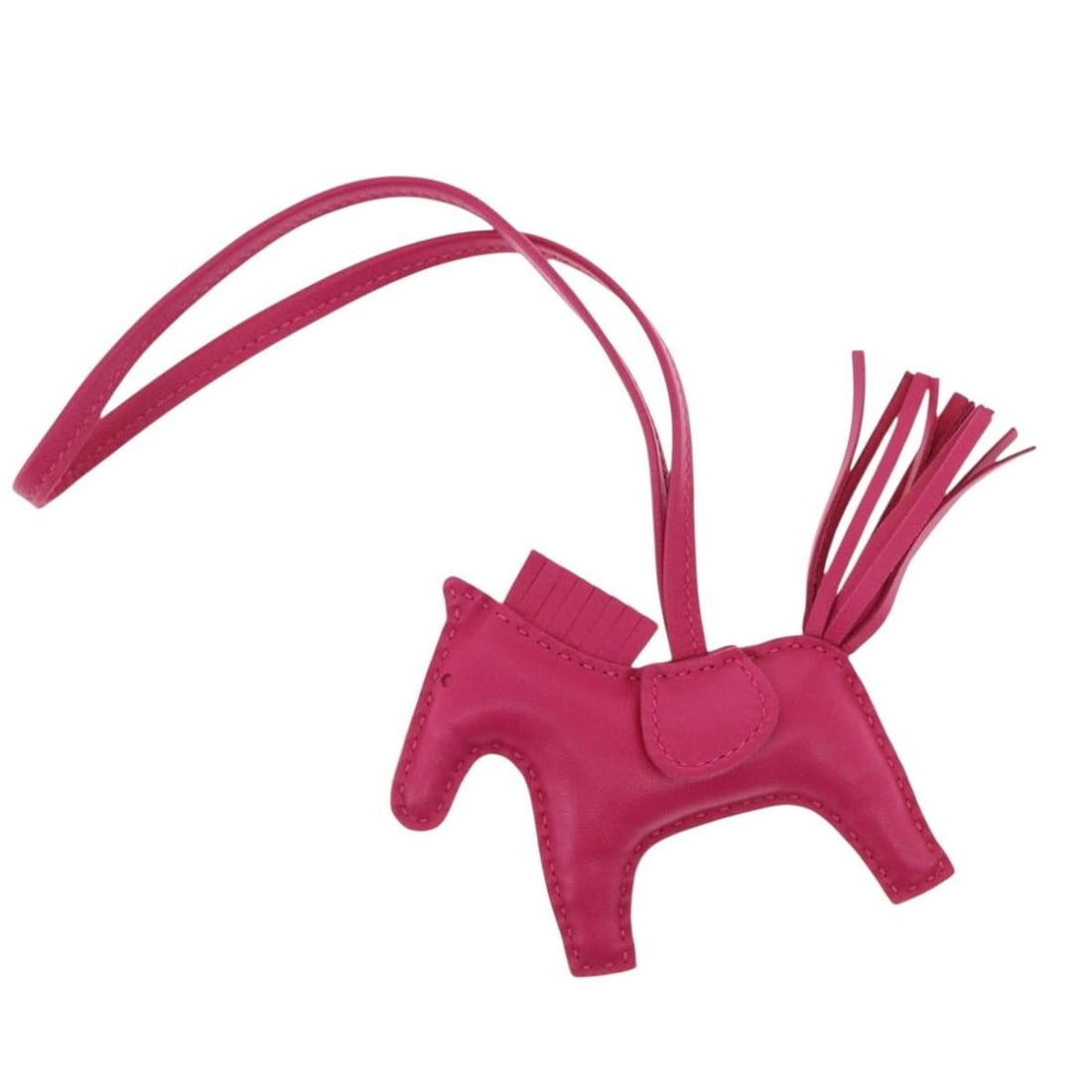 Pink Rodeo PM Leather Bag Charm by Hermes with Box and Dust Bag: Pink Rodeo PM Leather Bag Charm by Hermes with Box and Dust Bag This Hermes Rodeo Charm PM is crafted from pink leather and features a stylish horse motif. The item is in excellent, un-used condition