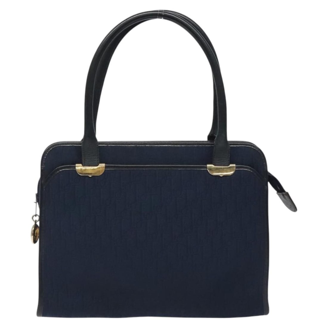Navy Canvas Trotter Shoulder Bag by Christian Dior Vintage Collection: Navy Canvas Trotter Shoulder Bag by Christian Dior Vintage Collection This Christian Dior Vintage Trotter handbag features a navy canvas exterior and is designed for women. Made in France, the bag dis