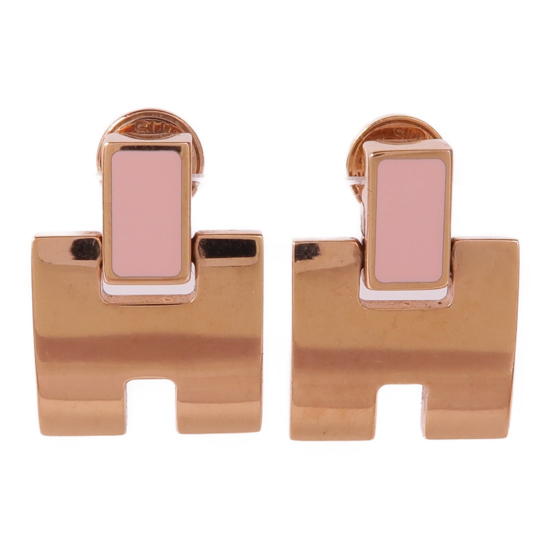 Pierced Earrings by Hermes in Pink and Rose Gold Tone Metal: Pierced Earrings by Hermes in Pink and Rose Gold Tone Metal Hermes pierced earrings crafted from a rose gold and pink-toned metal, featuring a minimalist design without any gemstones. These earrings a