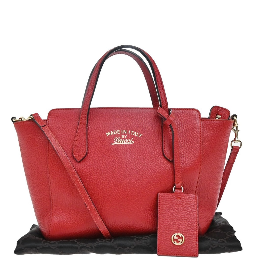 Red Leather Crossbody Bag Gucci Swing Model 22cm by 19cm by 10cm: Red Leather Crossbody Bag Gucci Swing Model 22cm by 19cm by 10cm This Gucci Swing Crossbody Bag for women features pebbled red leather and a compact design. It measures 22cm x 19cm x 10cm and is craft