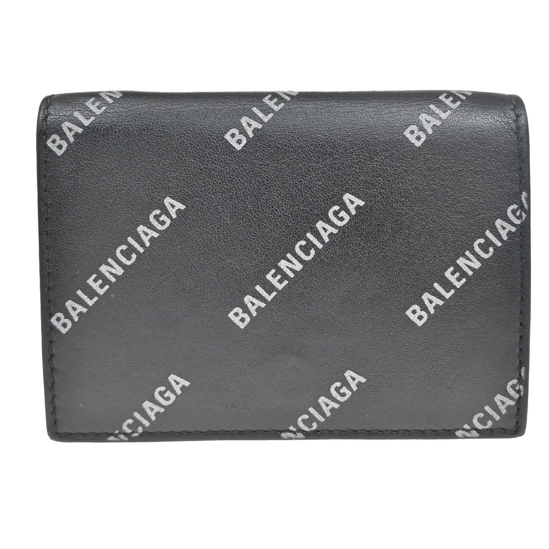 Leather Trifold Wallet by Balenciaga in Black Unisex: Leather Trifold Wallet by Balenciaga in Black Unisex This unisex Balenciaga trifold wallet is crafted from black leather and features a compact design suitable for everyday use. It shows signs of pre-