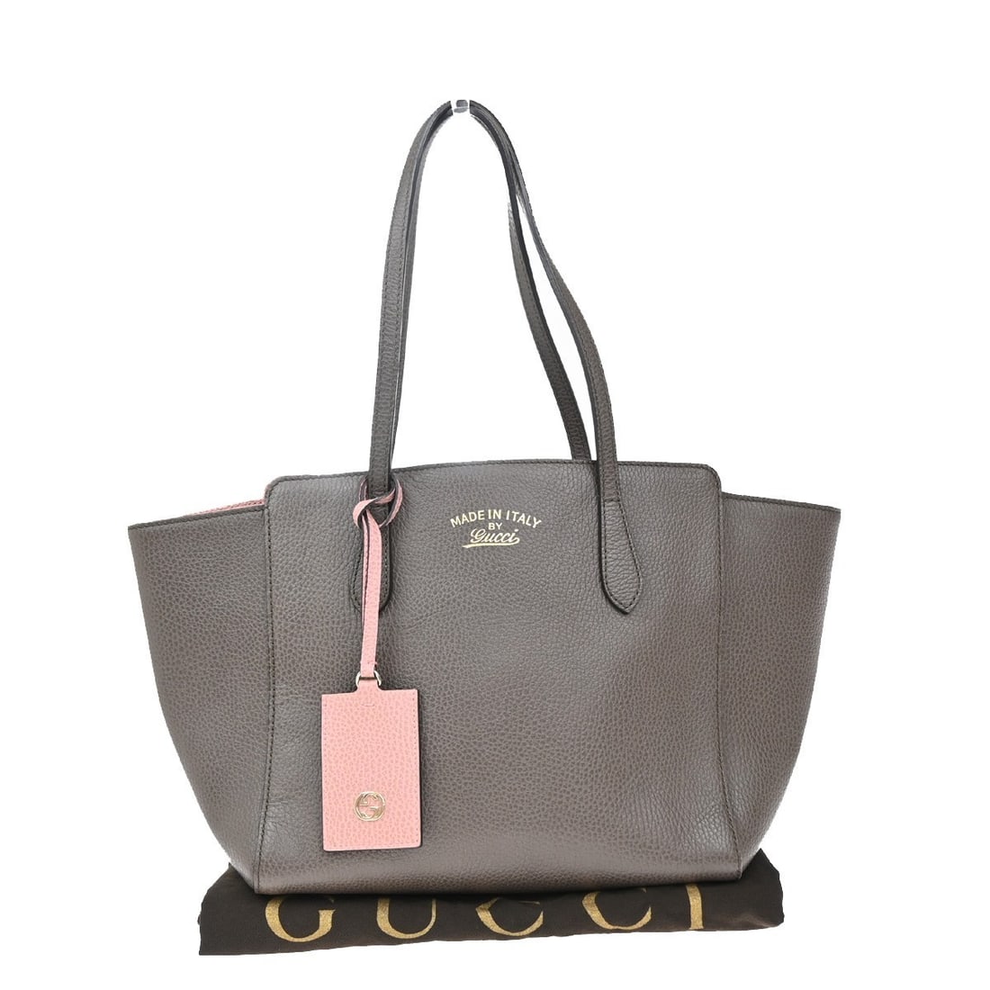Gray Leather Gucci Swing Tote Handbag 26cm by 23cm by 16cm: Gray Leather Gucci Swing Tote Handbag 26cm by 23cm by 16cm This Gucci Swing Tote for women features a gray leather exterior with a subtle leather scent. The pre-owned bag is in very good condition, sh