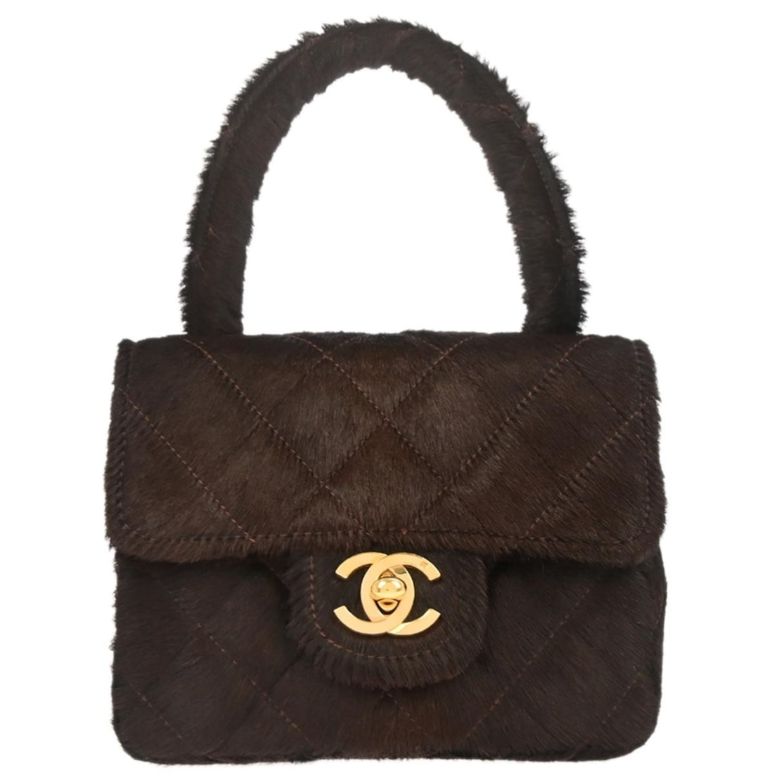 Mini Matelasse Quilted Pony Hair Top Handle Bag by Chanel in Brown: Mini Matelasse Quilted Pony Hair Top Handle Bag by Chanel in Brown This Chanel Micro Classic Flap handbag features a brown pony hair exterior with a matelasse quilted pattern. It is designed in a mini