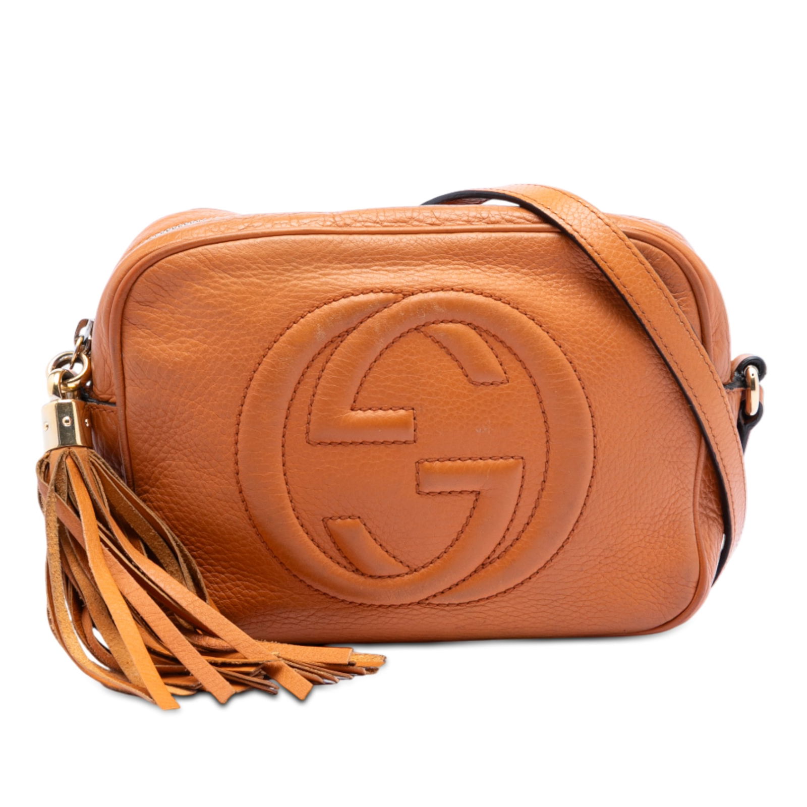 Orange Gucci Soho Disco Leather Crossbody Bag with Tassel: Orange Gucci Soho Disco Leather Crossbody Bag with Tassel This Gucci Soho Disco Crossbody features an orange leather body with a tassel detail, an adjustable flat leather strap, a top zip closure, and