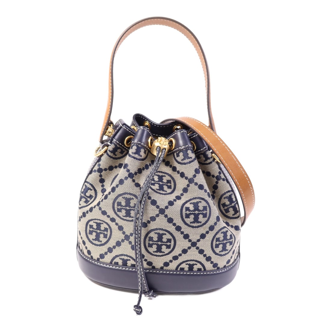 Tory Burch Navy Canvas and Leather Bucket Shoulder Bag with Gold Hardware: Tory Burch Navy Canvas and Leather Bucket Shoulder Bag with Gold Hardware This Tory Burch bucket bag features a versatile 2-way shoulder design crafted from navy leather and canvas. The bag is in very
