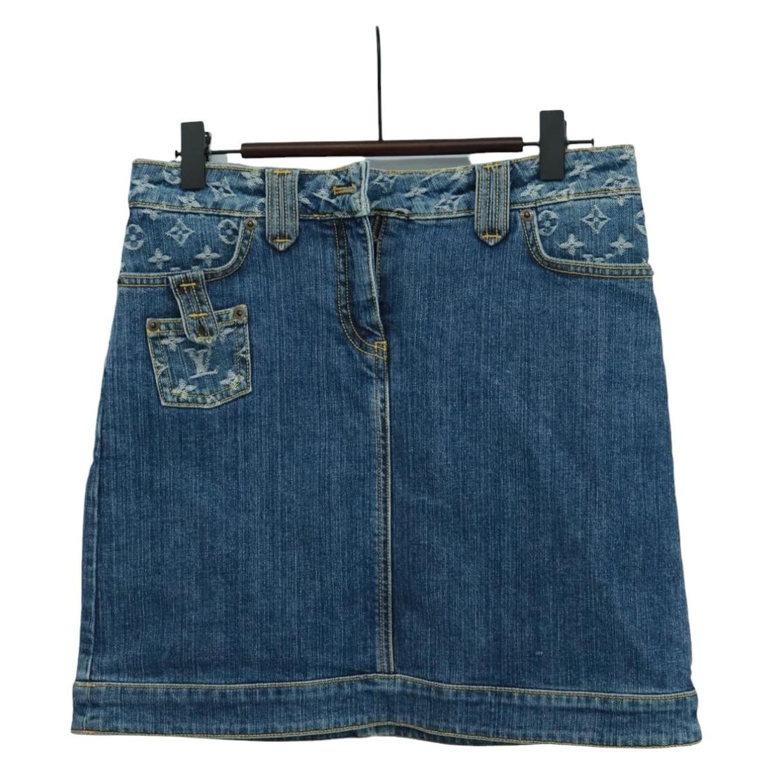 Blue Monogram Denim Canvas Skirt by Louis Vuitton Italy: Blue Monogram Denim Canvas Skirt by Louis Vuitton Italy This Louis Vuitton skirt features signature Monogram Denim Canvas in blue and is crafted in Italy. The skirt is designed with a waist measuremen