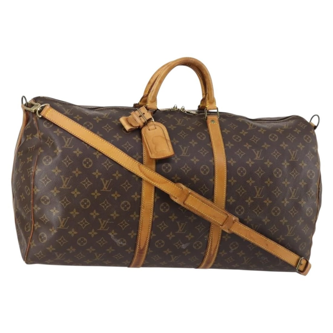 Louis Vuitton Monogram Canvas Keepall Bandouliere 60 Travel Bag: Louis Vuitton Monogram Canvas Keepall Bandouliere 60 Travel Bag The Louis Vuitton Keepall Bandouliere is a unisex travel bag crafted from monogram canvas with brown color accents. This pre-owned 60-si