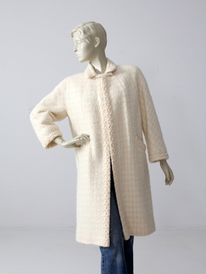 1950s Cream Wool Swing Coat Tober's Fashion Vintage: 1950s Cream Wool Swing Coat Tober's Fashion Vintage Step back in time with this exquisite 1950s vintage swing coat. Crafted from cream wool, this coat showcases a delicate white woven checker pattern
