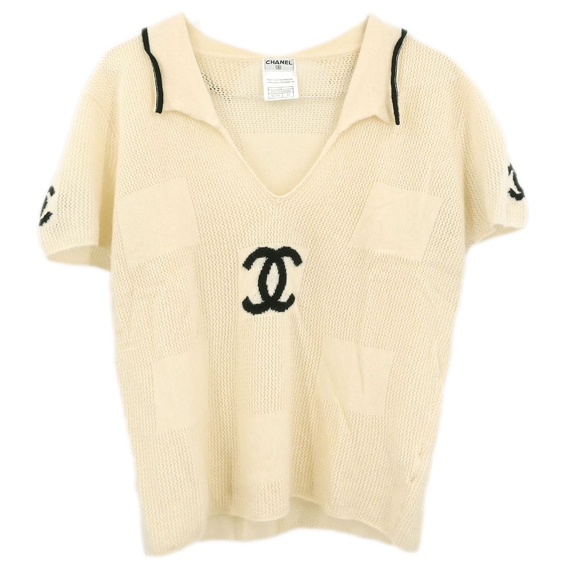 Chanel Off-White Vintage Cashmere Collared Short Sleeve Top Size 44: Chanel Off-White Vintage Cashmere Collared Short Sleeve Top Size 44 This Chanel top features a collared neckline and short sleeves, crafted from 100% cashmere in an off-white color. Designed with a re