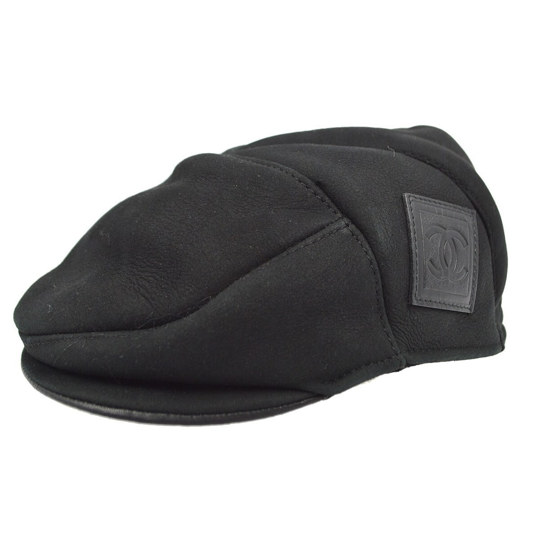 Chanel Sport Line Black Lambskin Hunting Cap Hat 57: Chanel Sport Line Black Lambskin Hunting Cap Hat 57 Discover the elegance of this Chanel Sport Line Hunting Cap, crafted from 100% lambskin for a luxurious feel. This stylish black hat is perfect for