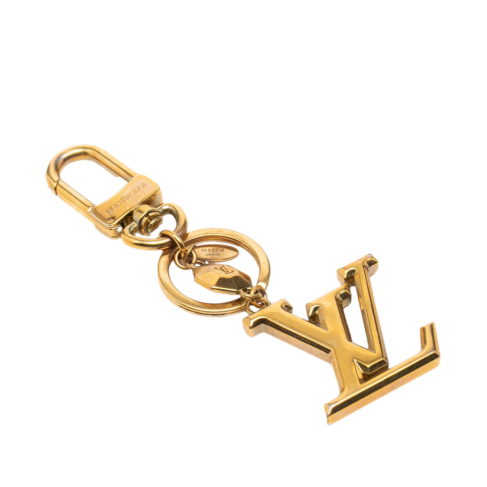 Gold Tone LV Facettes Charm Key Chain by Louis Vuitton: Gold Tone LV Facettes Charm Key Chain by Louis Vuitton This Louis Vuitton LV Facettes bag charm and key holder features a gold-tone metal construction, a branded charm, a key ring, and a lobster clasp