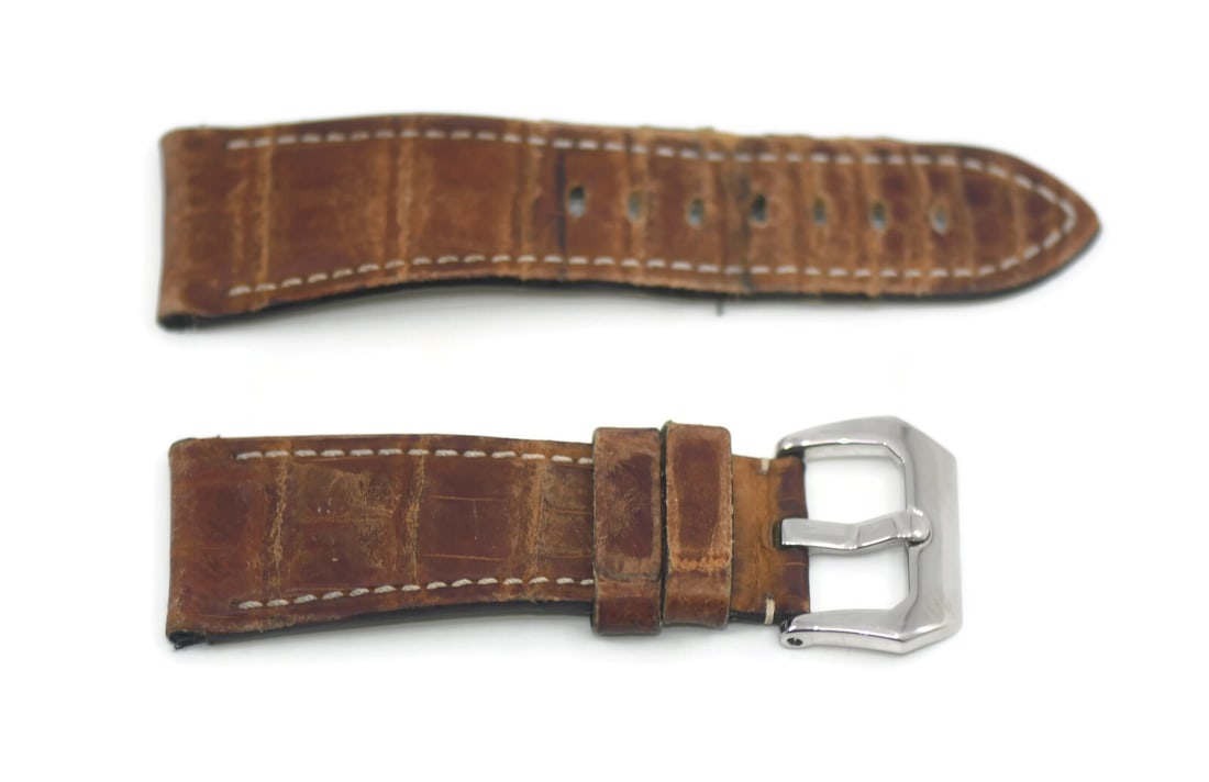 Authentic Panerai Brown Leather Wristwatch Band 26mm: Authentic Panerai Brown Leather Wristwatch Band 26mm Elevate your wristwatch with this genuine Panerai Brown Leather Strap. Crafted from high-quality leather, this strap features a classic brown color