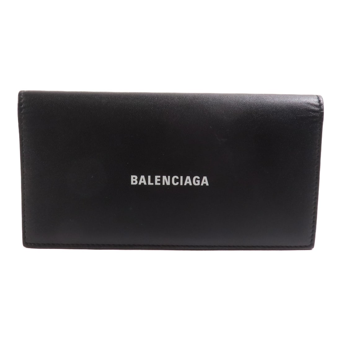 BALENCIAGA Bifold Long Wallet 594692.1090 Black Calfskin Leather: BALENCIAGA Bifold Long Wallet 594692.1090 Black Calfskin Leather This elegant BALENCIAGA Long Wallet is crafted from high-quality calfskin leather, showcasing a timeless black finish. Designed as a bi