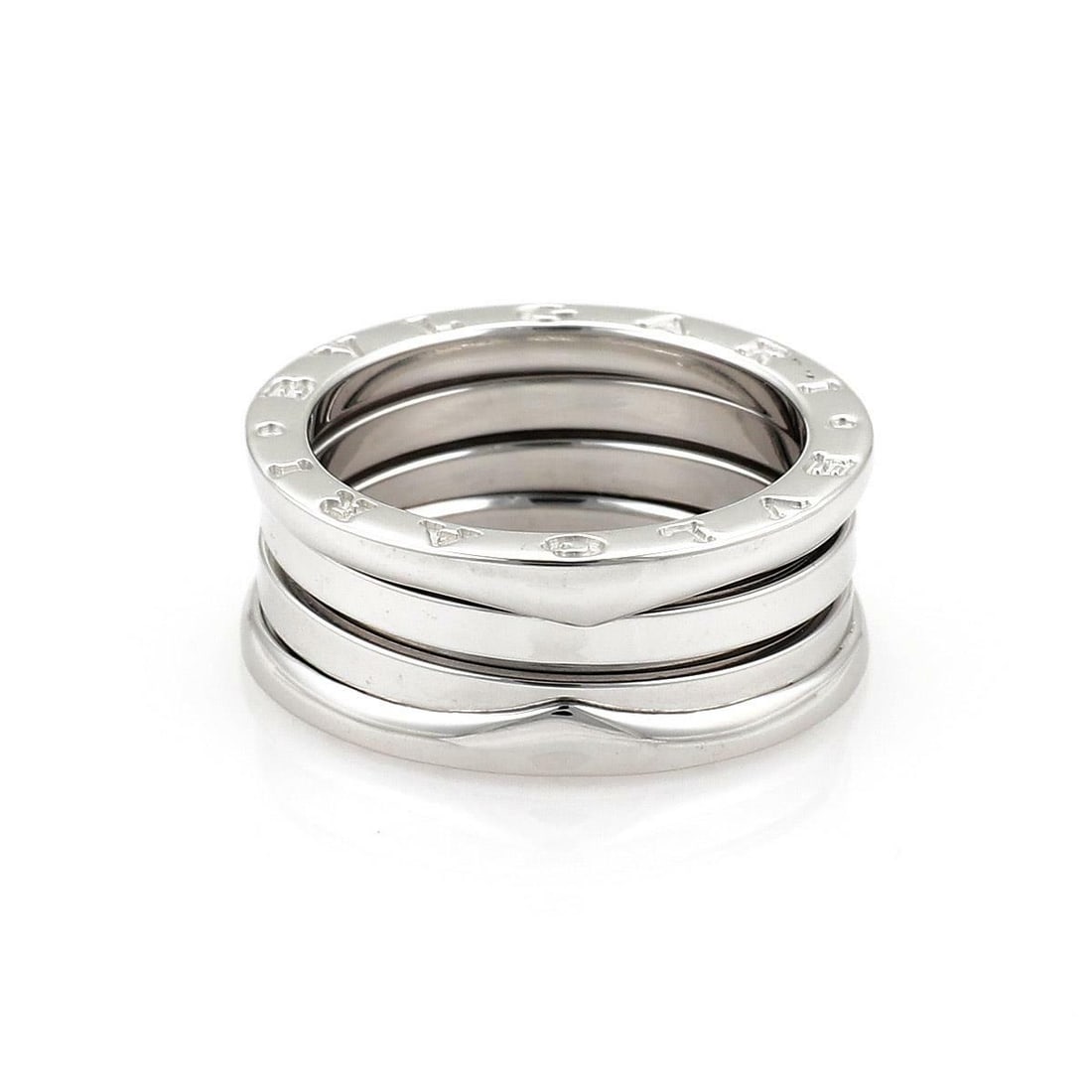 Bvlgari B Zero 1 18k White Gold 9mm Flex Band Ring US 7.5: Bvlgari B Zero 1 18k White Gold 9mm Flex Band Ring US 7.5 Discover the elegance of this authentic Bulgari B Zero 1 ring, expertly crafted from 18k white gold. This exquisite band features a unique fle