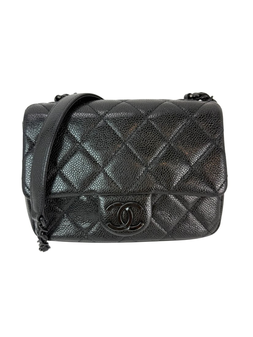 Chanel Caviar Quilted Mini Square Black Flap Bag Silver Hardware: Chanel Caviar Quilted Mini Square Black Flap Bag Silver Hardware Elevate your style with the Chanel Caviar Quilted Incognito Mini Square Black Flap Bag. This sophisticated crossbody bag features a chi