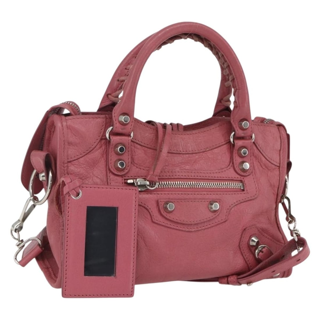 Pink Leather Mini City Satchel by Balenciaga with Shoulder Strap and Mirror: Pink Leather Mini City Satchel by Balenciaga with Shoulder Strap and Mirror This Balenciaga Classic Mini City handbag is crafted from pink leather with silver-tone accents. Designed for versatility, i