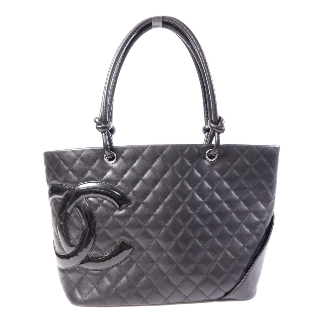 Chanel Cambon Black Calfskin Tote with Silver Tone CC Logo: Chanel Cambon Black Calfskin Tote with Silver Tone CC Logo This CHANEL Cambon tote bag is crafted from black calfskin leather and features the signature CC logo. Made in France, it offers a spacious i