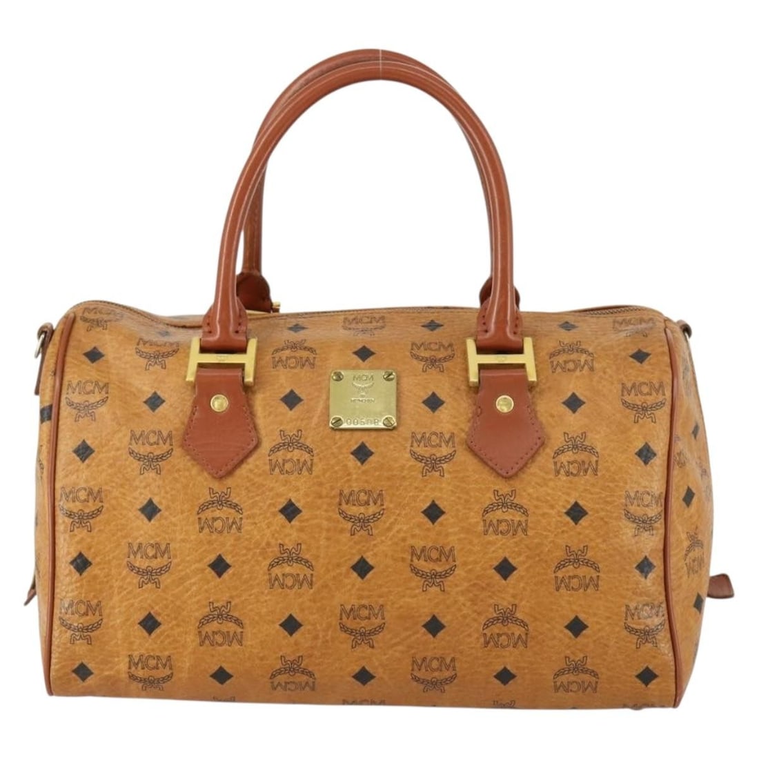 MCM Visetos Logogramme Boston Bag Brown Canvas Leather Germany: MCM Visetos Logogramme Boston Bag Brown Canvas Leather Germany This MCM Visetos logogramme handbag features a brown canvas exterior complemented by leather accents. Designed for women, this pre-owned