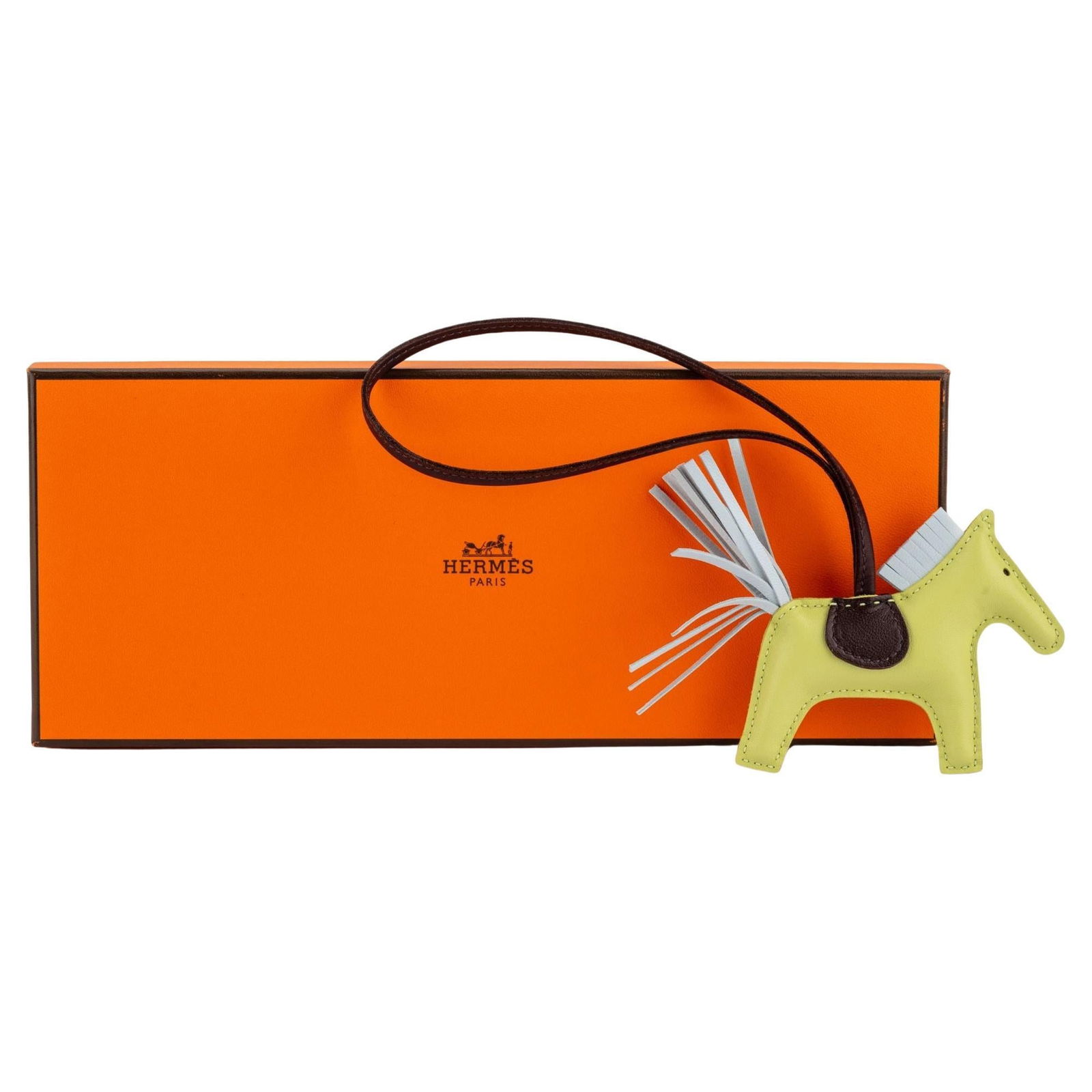 Hermes Jaune PM Grigri Rodeo Bag Charm Made in France: Hermes Jaune PM Grigri Rodeo Bag Charm Made in France Add a touch of luxury to your bag with this exquisite Hermes Jaune PM Grigri Rodeo Charm. Crafted from a stunning combination of jaune burgeon, bl