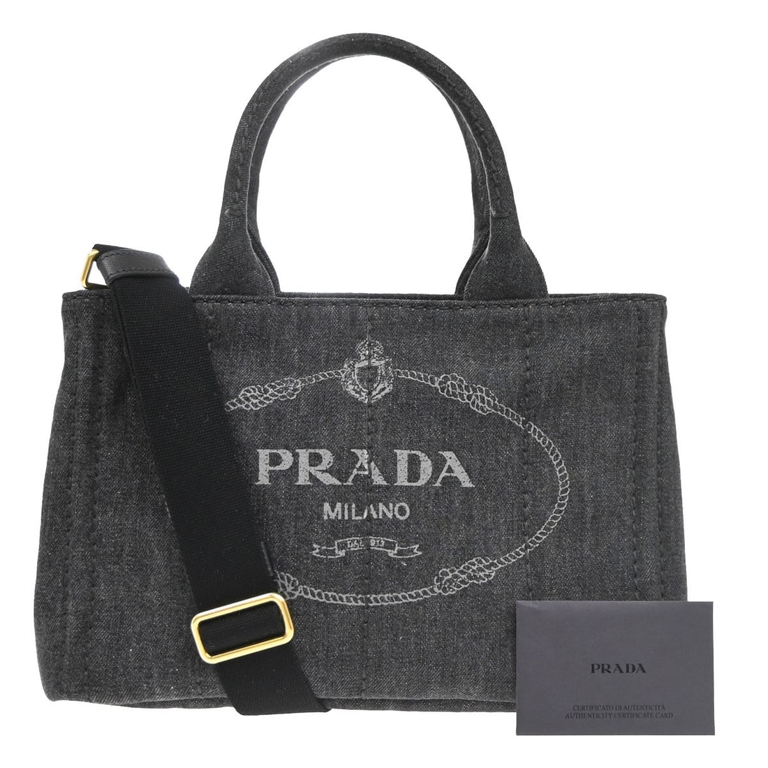 Prada Canapa Black Canvas Tote Bag 28cm: Prada Canapa Black Canvas Tote Bag 28cm This Prada Canapa Open Tote is crafted from black canvas and designed for women. Made in Italy, the tote features a spacious interior and sturdy construction. T