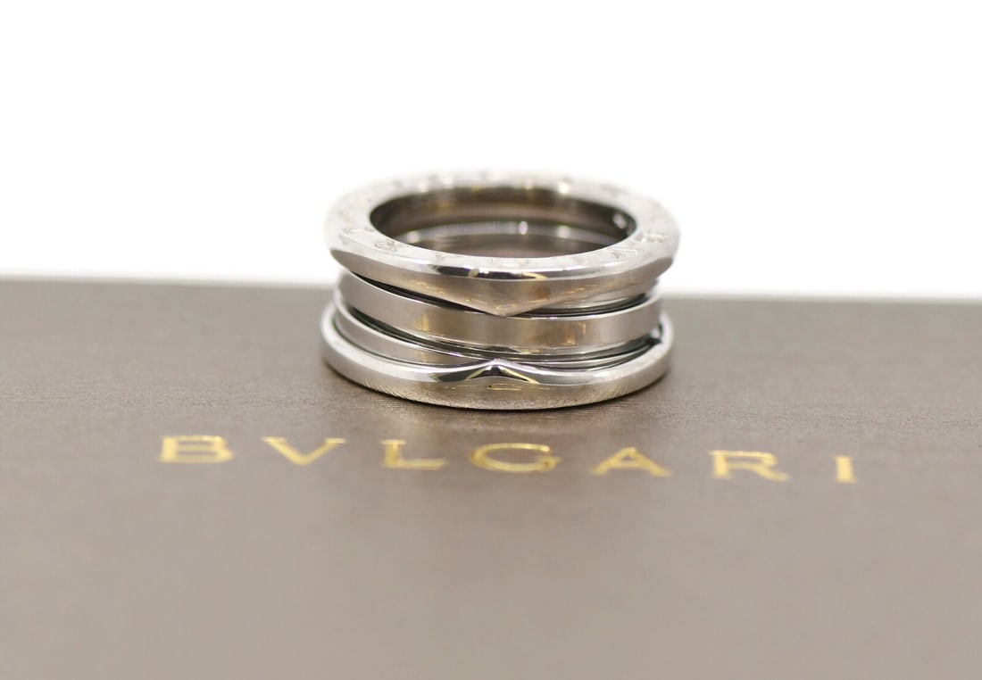 Bvlgari B.Zero1 18K White Gold Ring Size 5 Authentic: Bvlgari B.Zero1 18K White Gold Ring Size 5 Authentic This stunning Bulgari B.Zero1 ring is crafted from 18K white gold, showcasing a sleek and modern design. It is a size 5 and features a width of 8mm