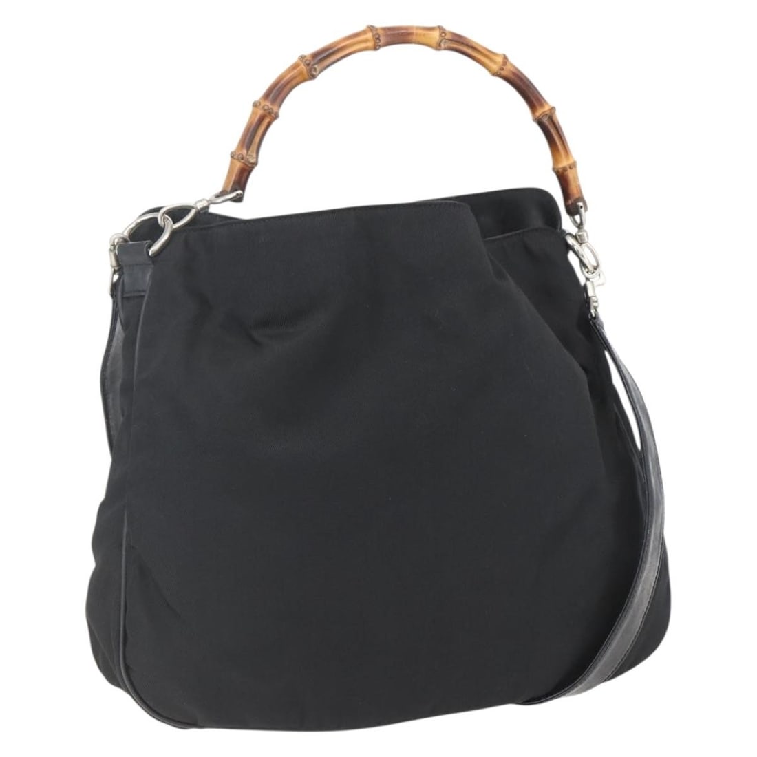 Black Nylon Gucci Bamboo Vintage Shoulder Bag: Black Nylon Gucci Bamboo Vintage Shoulder Bag This Gucci Vintage Bamboo Shoulder Bag is crafted from black nylon with bamboo accents. Designed for women, it features a spacious interior and a shoulder