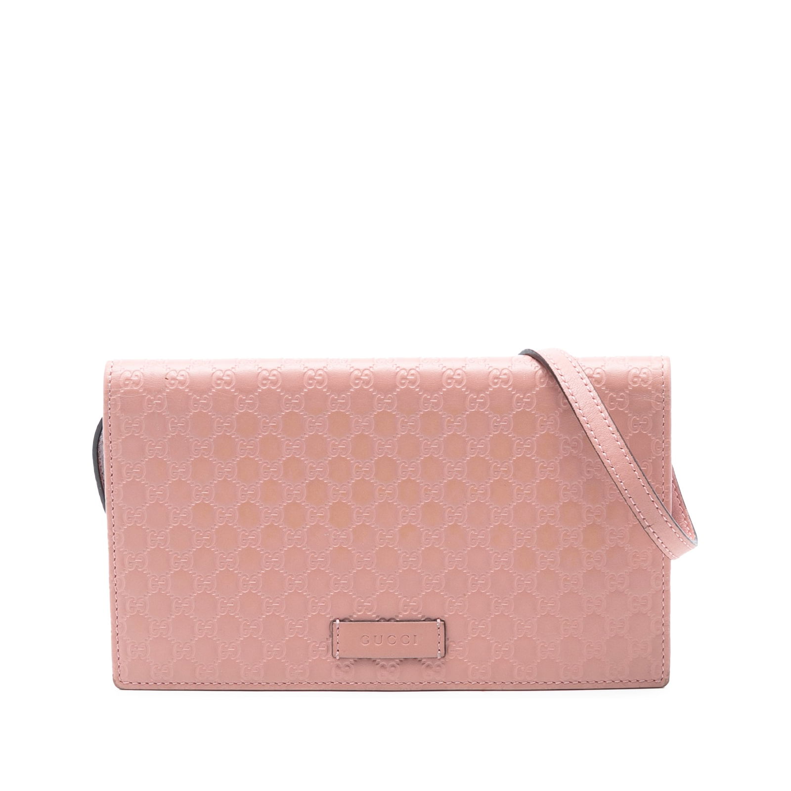 Gucci Microguccissima Pink Leather Crossbody Bag with Strap: Gucci Microguccissima Pink Leather Crossbody Bag with Strap This Gucci Microguccissima Wallet on Strap is crafted from embossed pink leather and features a flat leather strap, a front flap with magnet