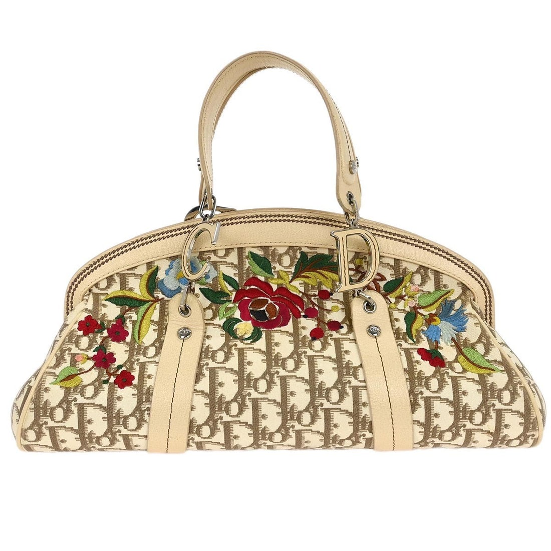 Dior Beige Floral Embroidered Trotter Top Handle Handbag 16-MA-0055: Dior Beige Floral Embroidered Trotter Top Handle Handbag 16-MA-0055 This elegant Christian Dior Beige Floral Embroidered Trotter Handbag is a stylish top handle bag crafted from a durable canvas leath