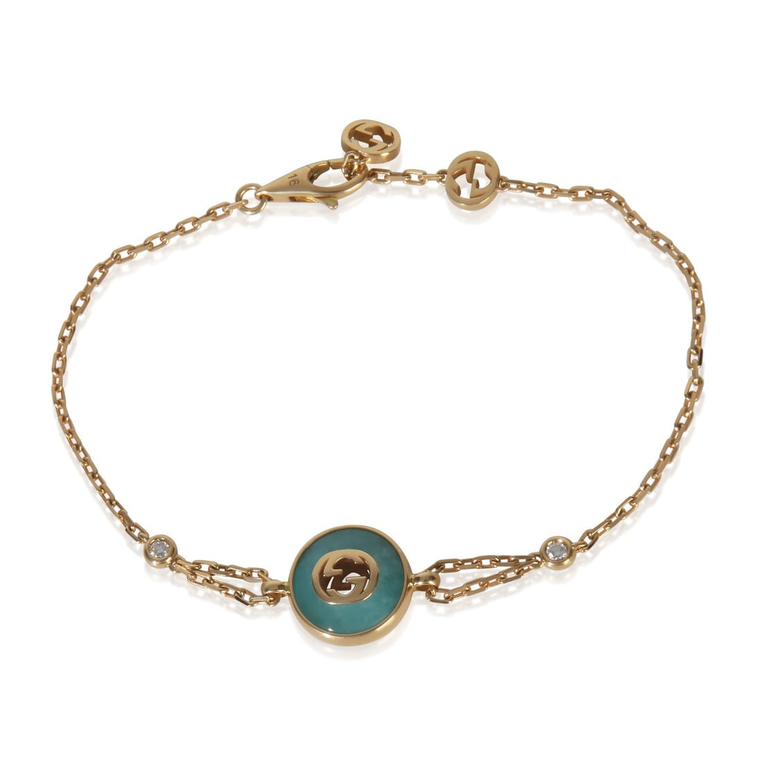 18k Yellow Gold Gucci Interlocking G Amazonite Bracelet with Box: 18k Yellow Gold Gucci Interlocking G Amazonite Bracelet with Box This pre-owned Gucci Interlocking G bracelet is crafted from 18k yellow gold and features a striking amazonite main stone. The bracelet
