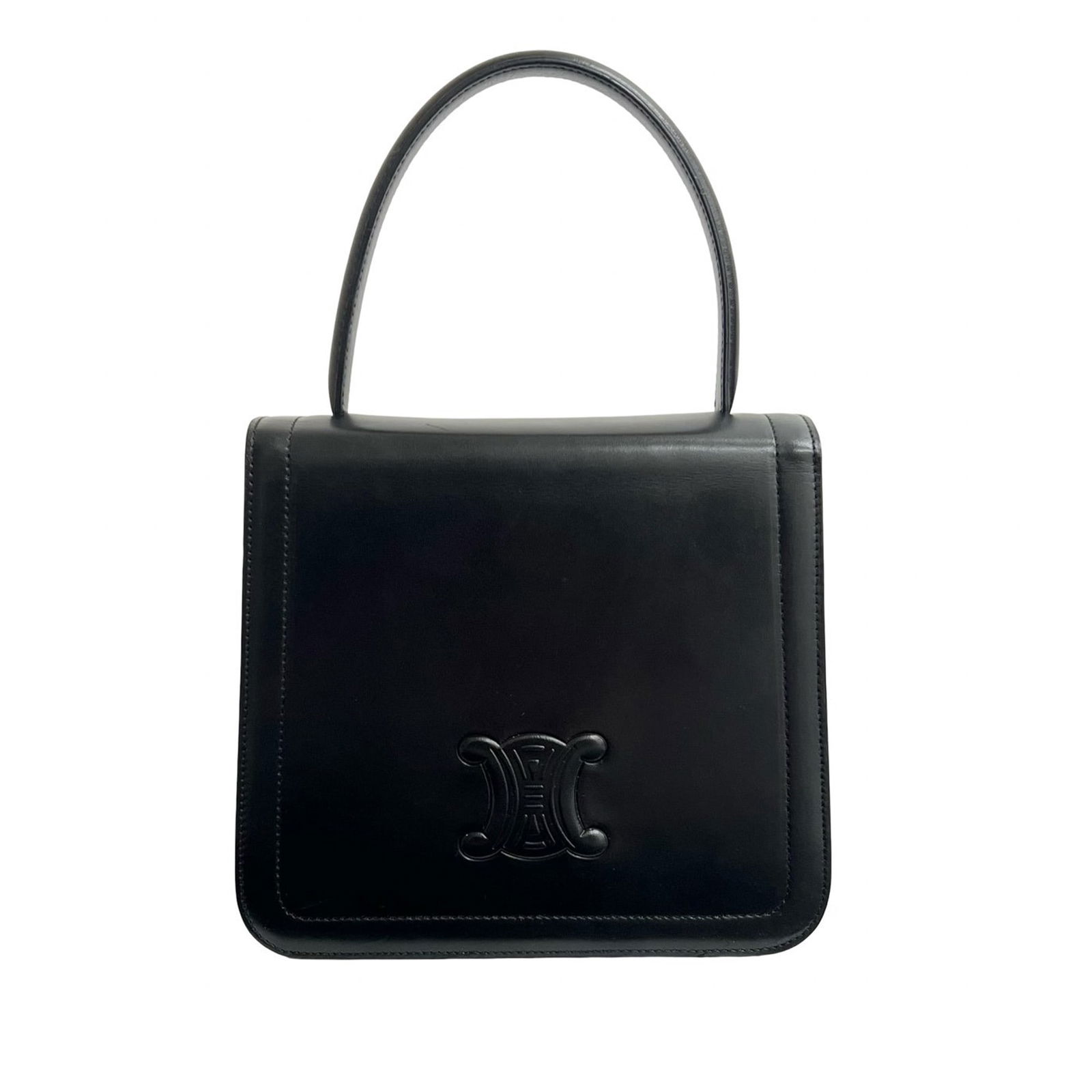 Celine Triomphe Black Leather Top Handle Bag: Celine Triomphe Black Leather Top Handle Bag The Celine Calfskin Triomphe Top Handle Bag is crafted from black leather and features a structured silhouette with a flat leather top handle. It includes
