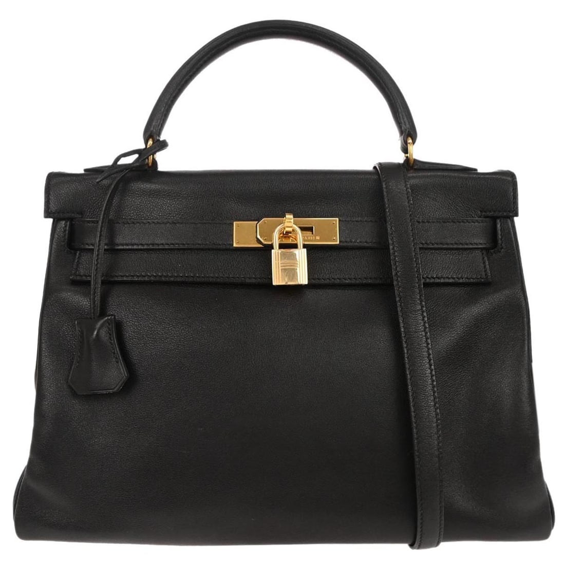 Kelly 32 Black Leather Top Handle Satchel with Detachable Strap by Hermes: Kelly 32 Black Leather Top Handle Satchel with Detachable Strap by Hermes This Hermes Kelly 32 Retourne 2way handbag features a black leather exterior and a medium-sized structured silhouette. It incl