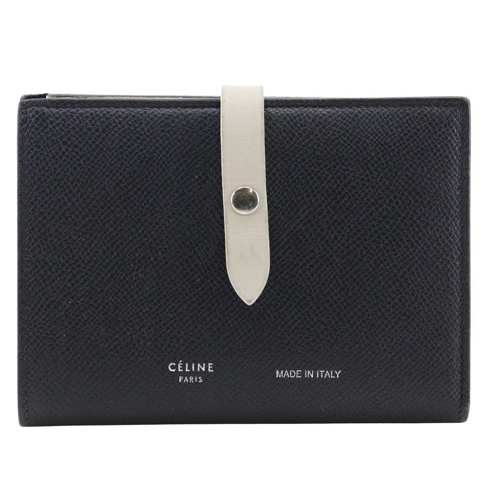 Celine Black Calfskin Leather Multifunction Strap Wallet: Celine Black Calfskin Leather Multifunction Strap Wallet This Celine Multifunction Strap Wallet is crafted from black calfskin leather and designed for women. It features a practical strap closure and